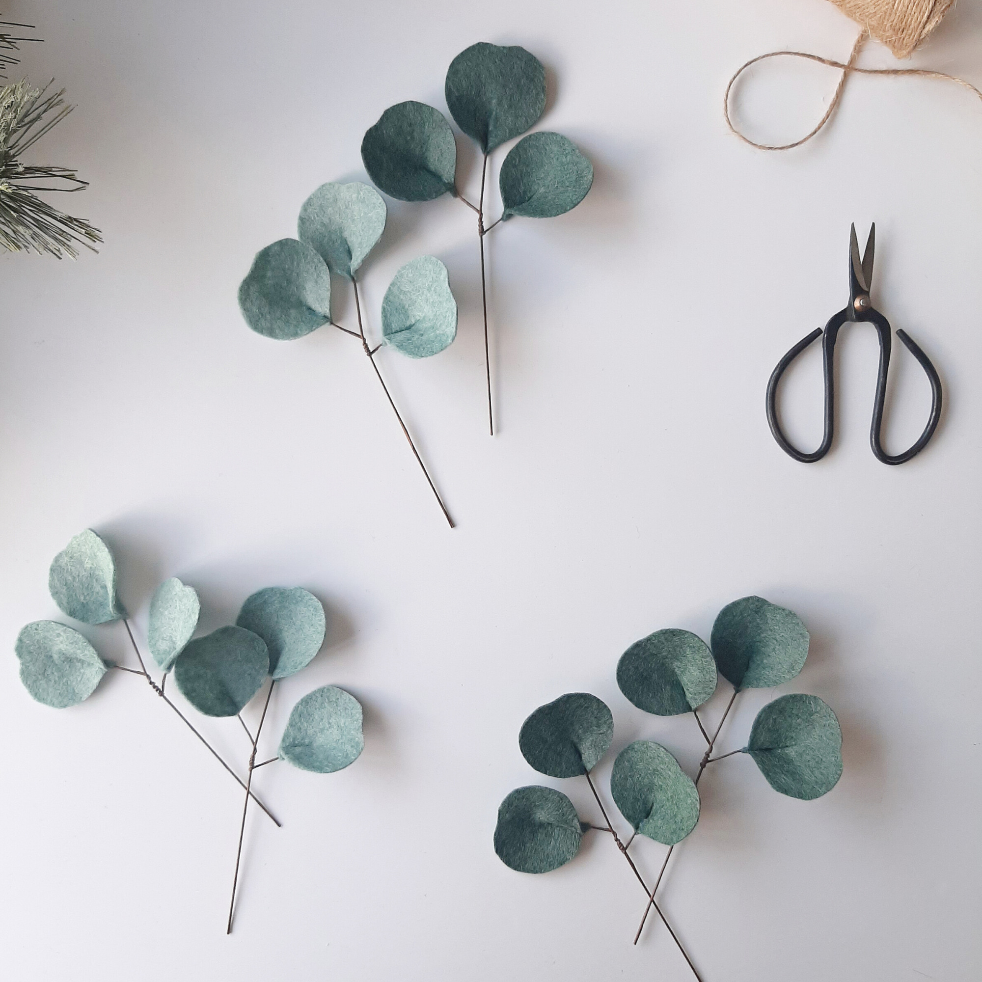 A pair of Silver Dollar Eucalyptus Décor – Short Stem - The Tsubaki