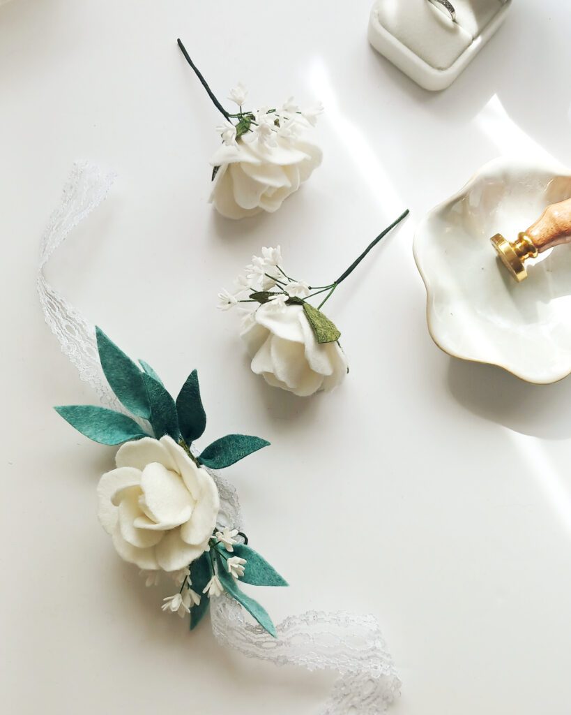 felt buttonhole and corsage set, white rose, baby's breath an eucalyptus