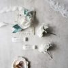 White rose babys breath corsage and boutonniere set image 1 White rose babys breath corsage and boutonniere set image 1